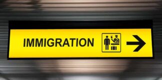 Immigration sign with arrow in airport