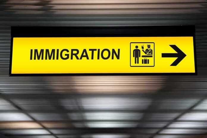 Immigration sign with arrow in airport