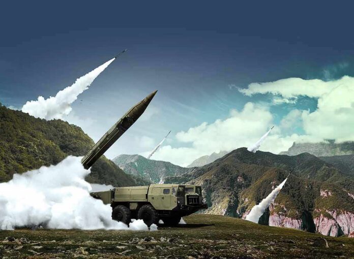 mobile missile launcher firing in mountain landscape