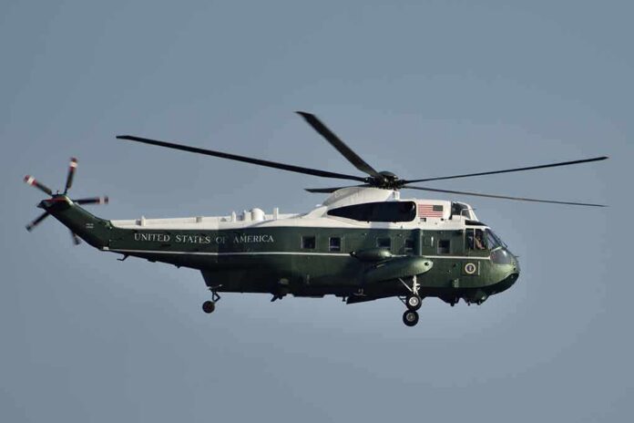 Green and white helicopter in flight