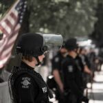 After A Deadly Shooting, Accountability Came Fast police officer in riot gear standing in a line