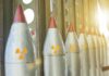 Row of missiles with radiation symbols in storage rack