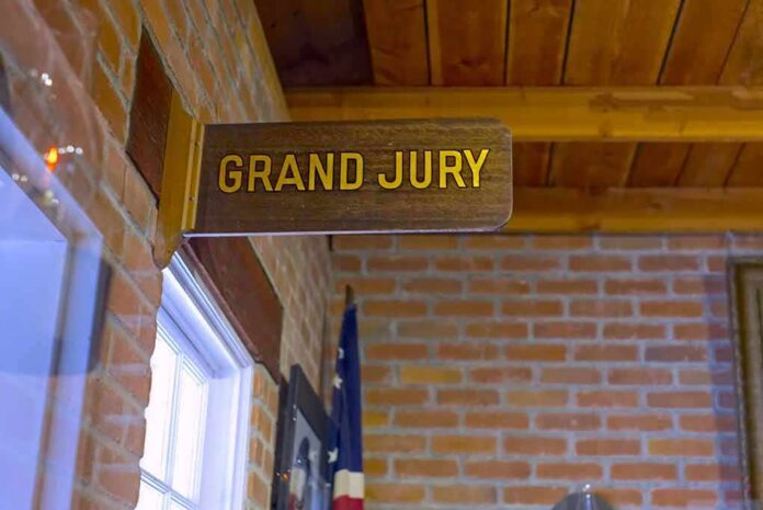 shutterstock_1162940617-1 Grand jury sign in a brick-walled hallway