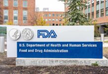 Mail-Order Pill Stays – Courts Pause FDA headquarters sign outside brick office buildings