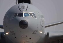 Airman Falls Mid-Show – Safety Gaps Exposed? Front view of a large military cargo aircraft on the runway