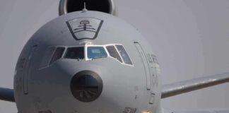 Front view of a large military cargo aircraft on the runway