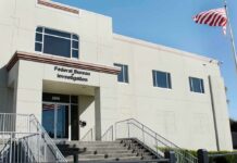 FBI office building with entrance steps and American flag