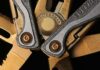Leatherman multi-tool close-up with metal blades and textured handles