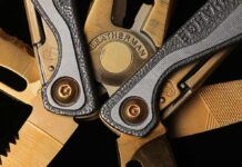 Leatherman multi-tool close-up with metal blades and textured handles