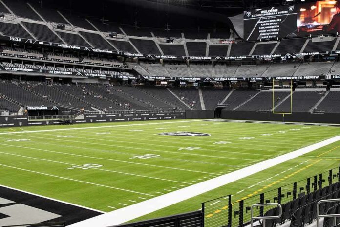 American football stadium interior with empty field and stands