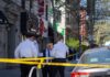 police officers and investigator at a taped-off city sidewalk