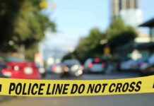 police tape blocking a blurred city street