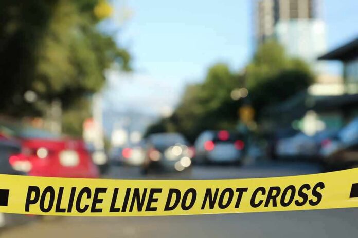 police tape blocking a blurred city street